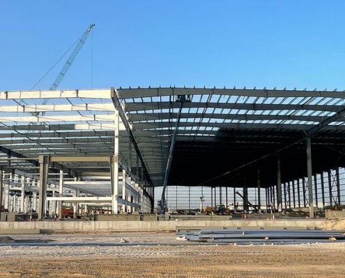 Panoramic view of the Amazon Fulfillment Hub steel structure under construction in Abu Dhabi