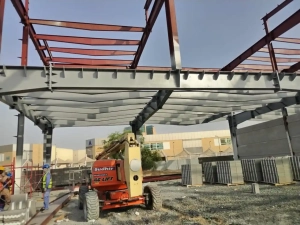 Steel structural frame under construction at a UAE warehouse project site, ready for fireproof coating application