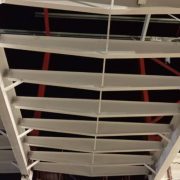 White intumescent paint coating applied to steel roof trusses for fire protection