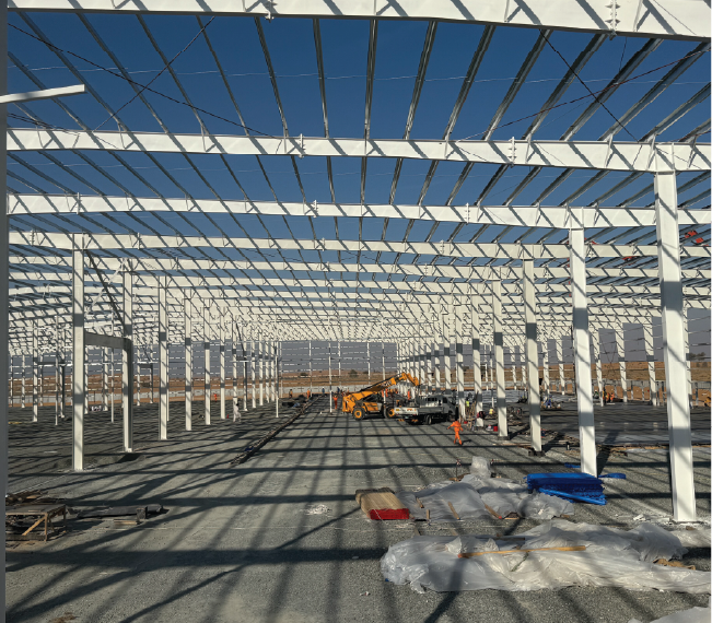Steel roof framing of a warehouse under construction, alternate angle